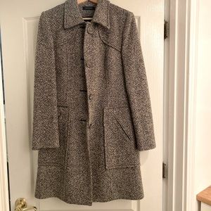 Short black/ white tweed knee length coat.